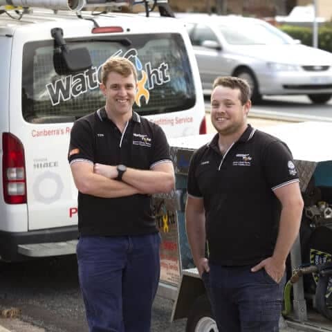 two members of the Water Tight Canberra team posing for a picture