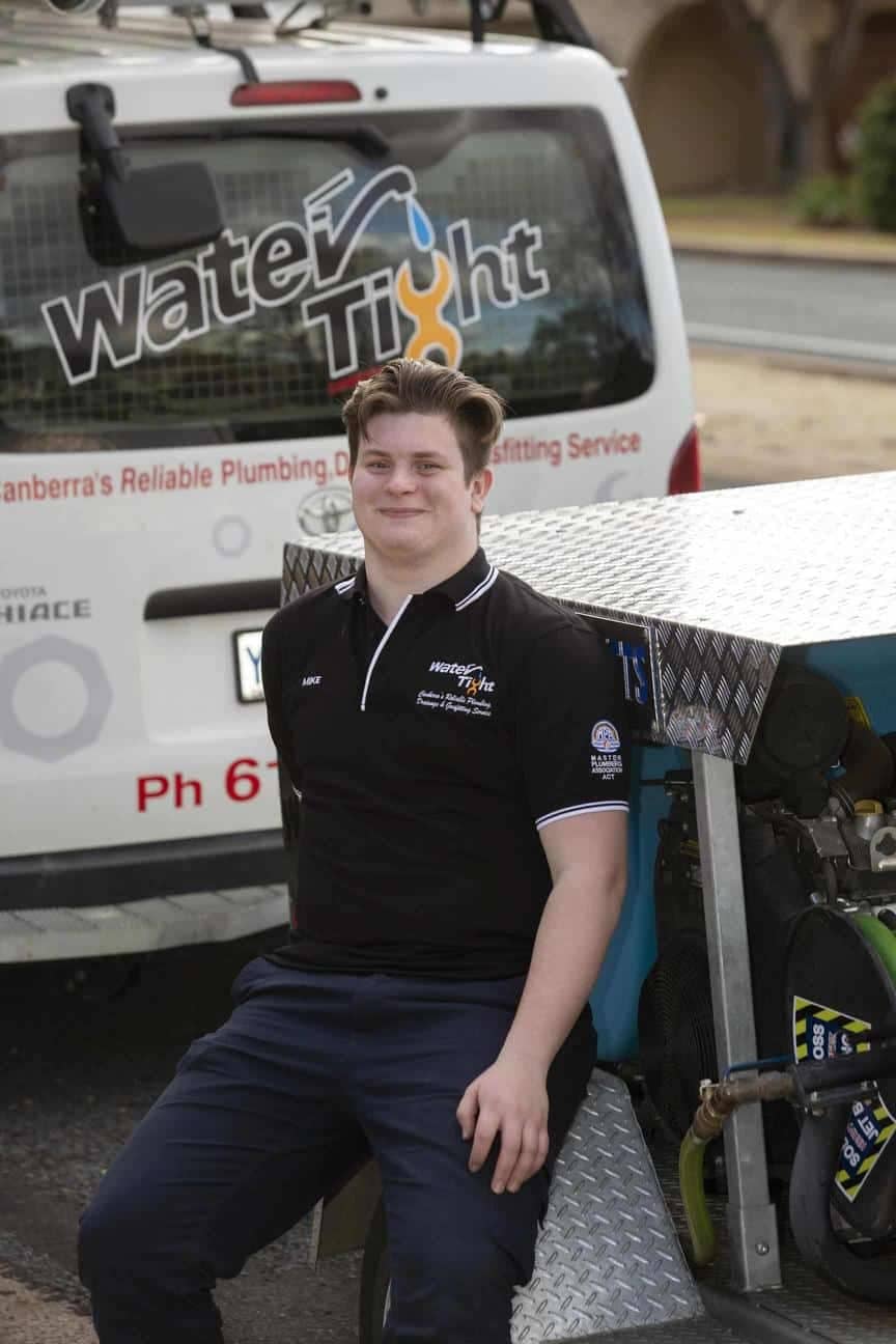 a member of the Water Tight Canberra team posing for a picture
